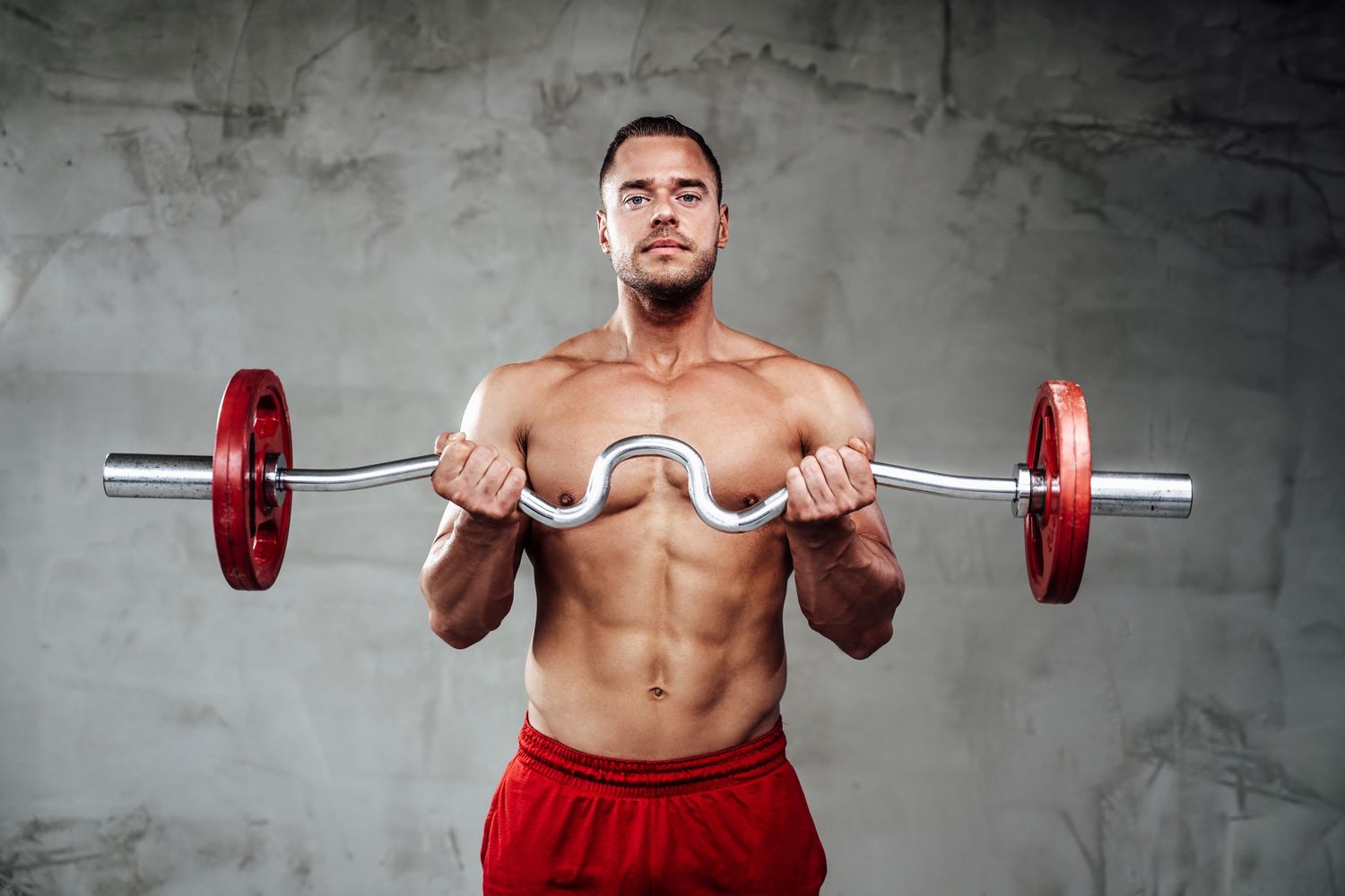 sportive guy with muscular hands lifting barbell i c9w5q47.jpg